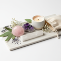Self care crystal kit with rose quartz amethyst selenite candle and dried flowers on white background